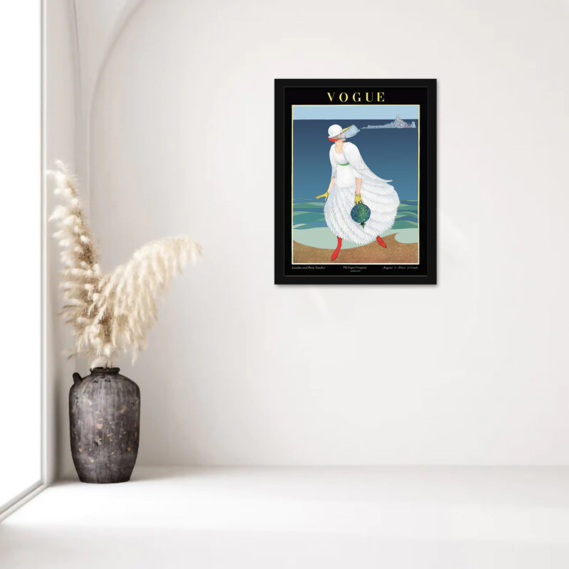 1916 Vogue cover print featuring a woman in a white dress on a beach.