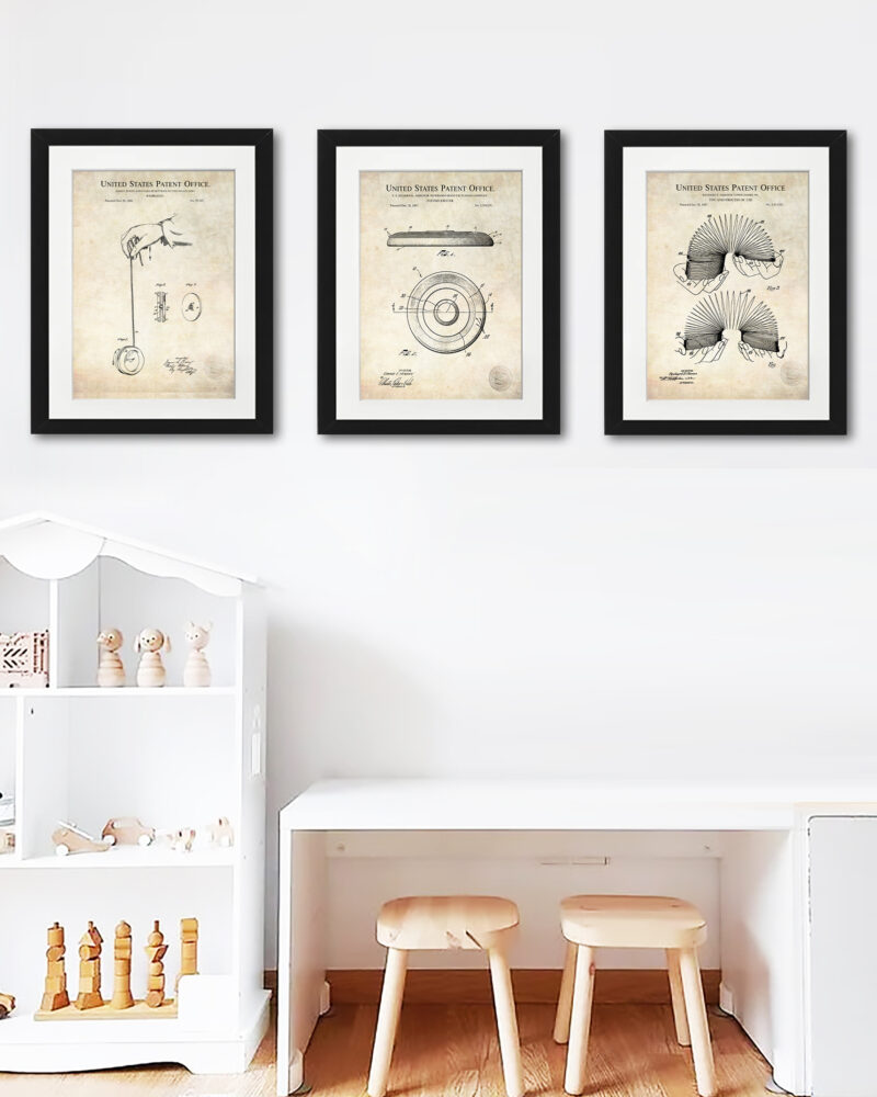 Collection of three vintage toy patent prints including a slinky, frisbee, and yoyo.