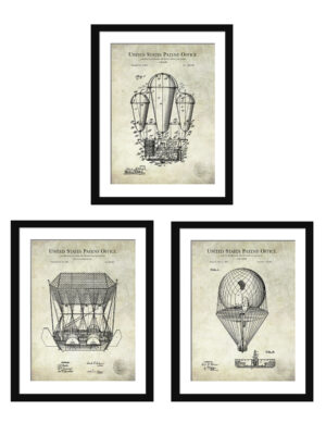 Set of three vintage airship patent prints framed on a wall.