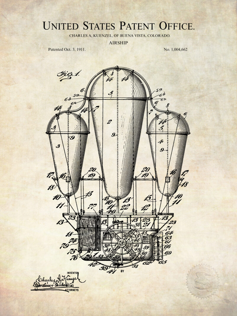 Set of three vintage airship patent prints framed on a wall.
