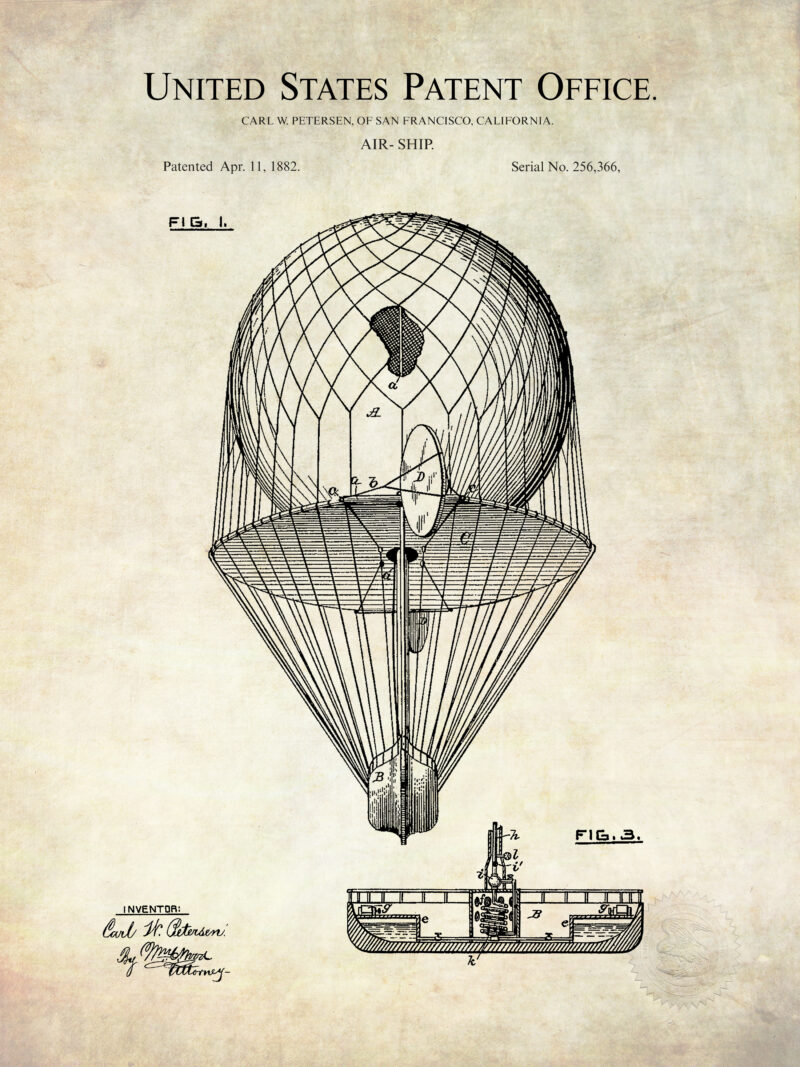 Set of three vintage airship patent prints framed on a wall.